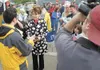 ROBERT DeBERRY/Frontiersman Gov. Sarah Palin answers questions
from the media Friday at the annual Governor’s Picnic in Wasilla
concerning accusations she pressured former state Department of