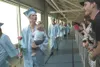 ROBERT DeBERRY/Frontiersman Spectators, friends and family cheer
on the graduating class of 2011 as they walk around the track at
the Curtis D. Menard Memorial Sports Center in Wasilla.