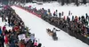 Dallas Seavey, of Talkeetna, waves to the crowd as he races through the chute on his way to Nome. J. David McChesney/Frontiersman