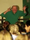 Michael Morgan animates academic learning through folk songs and
story telling, during a school assembly at Larson Elementary School
on Friday. BOB MARTINSON/Frontiersman