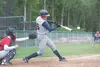 Blake Carricaburu connects with the ball during a Road Warriors game against the the Post 300 team from Napoleon, Ohio, at a recent game at McManus Field in Wasilla. ROBERT DeBERRY/Frontiersm