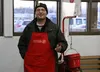 Bob Aubrey rings bells in the vestibule of the Wasilla Walmart Thursday morning. Aubrey said a man stole his kettle right as bell-ringers were changing shifts Wednesday night. Brian O'Connor/