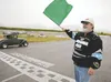 South Central Alaska Motor Sports Association Board President Ron Harvey drops the green flag on a cold-lap Model A classic car race Saturday at North Star Speedway. ROBERT DeBERRY/Frontiersm