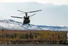 U.S. Army paratroopers assigned to the 4th Infantry Brigade Combat Team (Airborne), 25th Infantry Division, U.S. Army Alaska, wait for a CH-47 Chinook operated by the 1-52nd General Service A