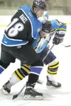 ROBERT DeBERRY/Frontiersman Avalanche defenseman Jason Cohen
pushes inside Wenatchee Wild right wing Nick Nagel on a face off
during the second period of Thursday's game at the Curtis C Menar