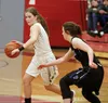 Colony senior Haylee Duguid moves the ball for the Knights during a win over Palmer in the Northern Lights Conferene girls semifinals at Wasilla High School. JEREMIAH BARTZ/ Frontiersman