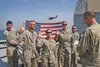 U.S. soldiers assigned to Alpha Company, 1st Battalion, 207th Aviation Regiment recite the re-enlistment oath Sept. 11 while aboard the USS Monterey (CG-61) in the Persian Gulf. Reciting the 