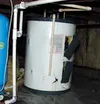 The water heater the builders installed was used, and turns off
constantly. Filkins must go down into the crawl space -- which is
filled with puddles from leaks in the bathroom above -- and t