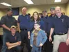 Christian Aldrich, 9, poses for a photo with a group of Mat-Su
Borough Emergency Medical Services employees during a tour earlier
this year. Since his accident, Christian has come to refer to