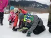 Sarah Carter with the Alaska Avalanche Information Center demonstrates how to use an avalanche transceiver to conduct a companion rescue during a field training with families. dmcghan@alaskas