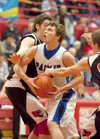 Connor Looney drives to the basket during Plamer's game against the Kenai Kardinals at the Northern Lights Conference Championships basketball tournament at Wasilla High School. Robert DeBerr