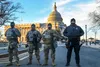 From left: U.S Army Sgt. Gio Carter, Sgt. Aaron Hampton, and Pvt. Cody Harrison, all with Forward Support Company 507th Engineer Battalion, Michigan National Guard, provide security with U.S.
