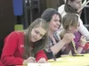 HEATHER A. RESZ/Frontiersman Authors Anna Parret and Allie Poe
sign copies of the newly released ‘With These Hearts and Hands,’
May 12 at Colony Middle School.