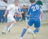 JEREMIAH BARTZ/Frontiersman Colony senior Cody Frtiz, left,
passes the ball to the center of the field during a 4-3 loss to
Soldotna on Friday at Colony High School.