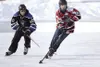Noah Gillespie, skating on a team sponsored by Rep. Mark Neuman in the U18 division, moves the puck forward during a game of 4-on-4 pond hockey on the first day of the Last Frontier Pond Hock