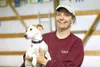 Claudia Sihler, with her Jack Russell, Lucy, at her dog training
facility off Fairview Loop Road. Sihler helps dog owners and their
canines deal with training issues, as well as teaching them