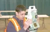 Michael Rovito/Frontiersman Casey Castillo, a sophomore at
Burchell High School, peers through a surveying device at the first
Construction Career Day recently at the Alaska State
Fairgrounds