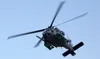 An Alaska Air National Guard HH-60G Pave Hawk helicopter assigned to the 210th Rescue Squadron passes over Malemute Drop Zone during a capabilities exercise at Joint Base Elmendorf-Richardson