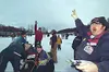 Right, Knik 200 starter Terry Langholz counts down to one as
musher Paul Pettyjohn raises his hand to the crowd moments before
his start. WILLIAM WOODY/ Frontiersman