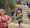 Colony freshman Jill Bowker leans into a curve on the state course at Bartlett High School Oct. 4. Bowker finished fifth overall in the 4A girls race of the ASAA/First National Bank State Cro