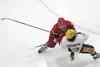 Wasilla defenseman Andrew Cooley forces Dimond's Brandon Sakumoto to the ice during a 4-3 win over the Lynx Thursday in the first round of the ASAA First National Cup. MatSuSports.net