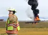 Mat-Su Borough deputy director of fire Ken Barkley talks on the phone while at the scene of a vehicle fire alongside the Glenn-Parks highway interchange on Sept. 12, 2015. On Thursday, May 26