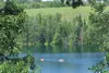 A trio of swimmers make their way across Matanuska Lake. (ROBERT DeBERRY/Frontiersman) Frontiersman file photo