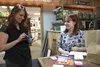 Emaline Buchanan and her mother Shawna Williams show the contents of the Duchess Pouches feminine hygiene kits at Tracy's Treasures. Jacob Mann/Frontiersman
