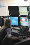 Dispatcher Salley Beach checks a computer-assisted dispatch screen Dec. 22 at the Palmer Dispatch Center in this Frontiersman file photo. Officials in the Mat-Su borough are considering chang