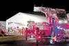 JOHN BORLAND/www.morffed.com Firefighters work to save a
building after a fire on a drilling rig ignited nearby.