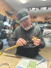 Mike Hudson from 3 Rivers Fly and Tackle epoxies on a cork handle for a custom-made sockeye rod for fishing the Kenai. They offer rod building courses during the winter, a gift that keeps on 
