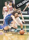 Palmer's Alicia Smylie and Wasilla's McKenna Dinkel chase after a loose ball during the second half of Wasilla's 45-33 win over Palmer in the Northern Lights Conference quarterfinals on Thurs