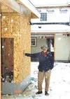 Bill Scharrer, executive director of Valley Residential
Services, stands by a building under construction at Forest Hills,
an apartment complex VRS is building in Wasilla. VRS has acquired
tw
