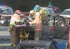 Rescue personnel remove the driver of a Ford Explorer Monday
evening after a two-vehicle accident at the intersection of
Knik-Goose Bay Road and Fairview Loop. Traffic was shut down in
both d
