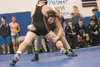 Palmer's Grayden Powell grapples with Houston's Caleb Kopp Thursday at the Lancer Smith Duals. ROBERT DeBERRY/Frontiersman.com