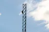 A worker scales a newly erected 180-foot tower near the Palmer-Wasilla Highway and Shennum Drive. Mat-Su Borough assemblyman Warren Keogh and borough mayor Larry DeVilbiss are both proposing 