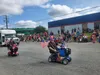 WASI residents wave to spectators in downtown Wasilla during the city's 2021 Fourth of July Parade. Jacob Mann/Frontiersman
