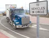 ROBERT DeBERRY/Frontiersman Carlile Transportation truck
navigates the new Trunk Road roundabout during a test run Monday
afternoon.