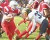 Wasilla running back Chris Bydlon stiff-arms a Bartlett defender
Friday during the Warriors’ season opener at Wasilla High School.
The Bears beat the Warriors 39-0. JEREMIAH BARTZ/Frontiersma