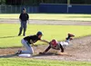 Palmer Pioneers first baseman Zach Satterly applies the tag as Wasilla's Ben Werner tries to get back to first during Wasilla's 10-0 win over the Pioneers during the first day of the annual T