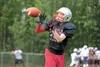 Wasilla's Kevin O'Loughlin catches a pass during football drills at the All-Alaska Football Camp Monday at Wasilla High School. This is the 21st year for the camp, which attracts players from