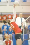ROBERT DeBERRY/Frontiersman Wasilla senior Kelsie Cline taps the
ball back to Palmer during Thursday night's match at Palmer High
School