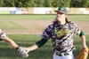 Brick Paskiewicz of the Mat-Su Miners slaps the hand of a teammate as he runs into the dugout following his catch in right field during a win over Chugiak early in the season. Paskiewicz, an 