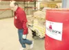 ROBERT DeBERRY/Frontiersman Food Bank of Alaska Operations
Manager Eddie Rackette moves a pallet of food out of the food bank
warehouse Wednesday morning. The building is the new home of the
