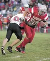 David Green breaks a Houston Hawk tackle during a game in 2010.
Green signed his National Letter of Intent to attend the University
of Nevada-Las Vegas and play football for the Running Rebel