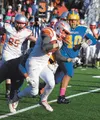 Wasilla's Sean McDermott tries to gain extra yardage in the second half of the Warriors' state playoff game at Bartlett on Saturday. MATT HICKMAN/Frontiersman