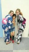Seventh-grade Palmer Junior Middle School student Zoe Copp, right, and another exchange student visit with a girl from a local host family in Saroma, Japan in mid-June. Courtesy Kim Akers
