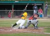 Mat-Su Miner Christin Stewart slides past Chugiak-Eagle River Chinook catcher Daniel Salters during Saturday’s game at Hermon Brothers Field in Palmer. ROBERT DeBERRY/Frontiersman.com