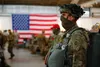 A paratrooper assigned to 1st Brigade Combat Team, 82nd Airborne Division, prepares for an airborne training operation at Fort Bragg, N.C., on May 7, 2020. The operation marked the division's