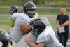 Redington lineman TJ Laumatia works with a teammate during a drill as the Huskies held a team practice Wednesday, Aug. 10, 2016, at Redington Jr./Sr. High School. The Huskies,a second-year fo